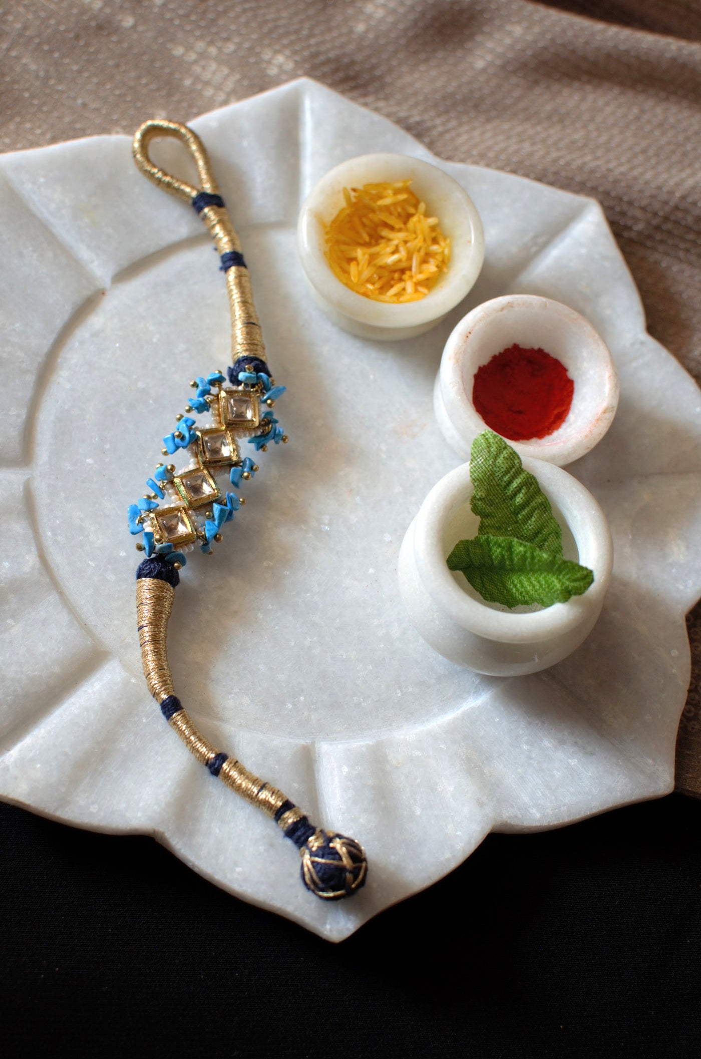Turquoise and blue polki rakhi bracelet